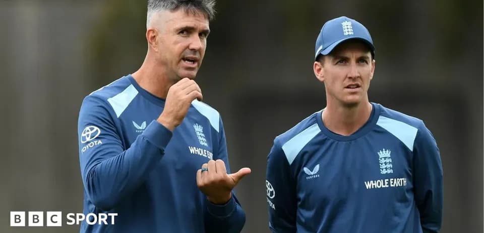 Coach discussing strategy with player during training
