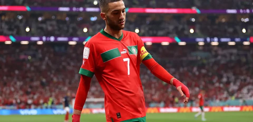 Moroccan player walking on pitch during match