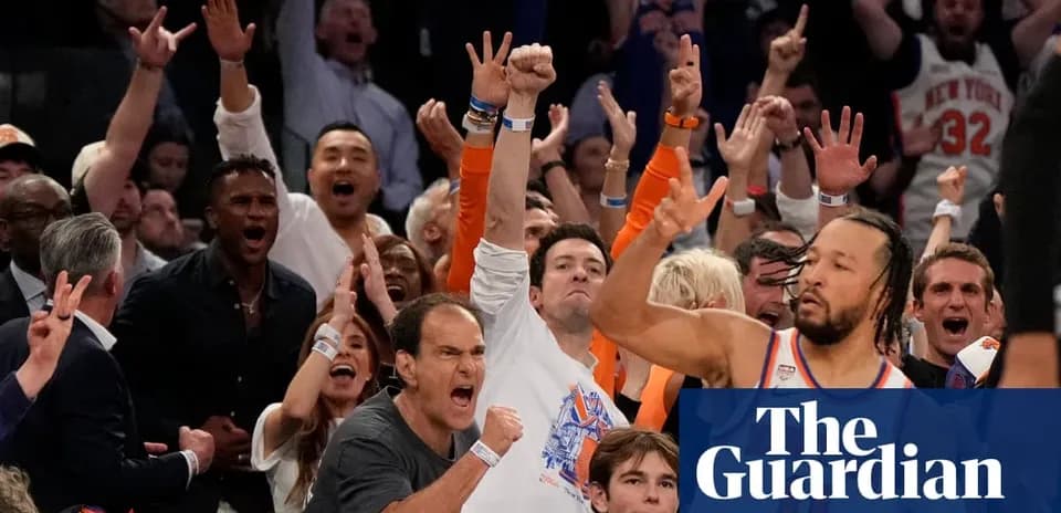 Excited crowd cheering during basketball game