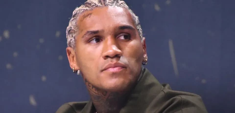 Athlete with braided hair at a press event