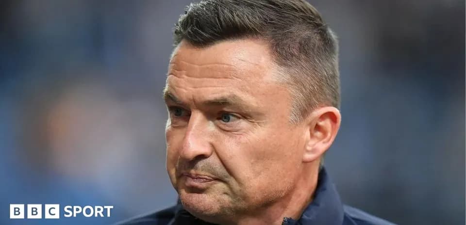 Coach with focused expression during match