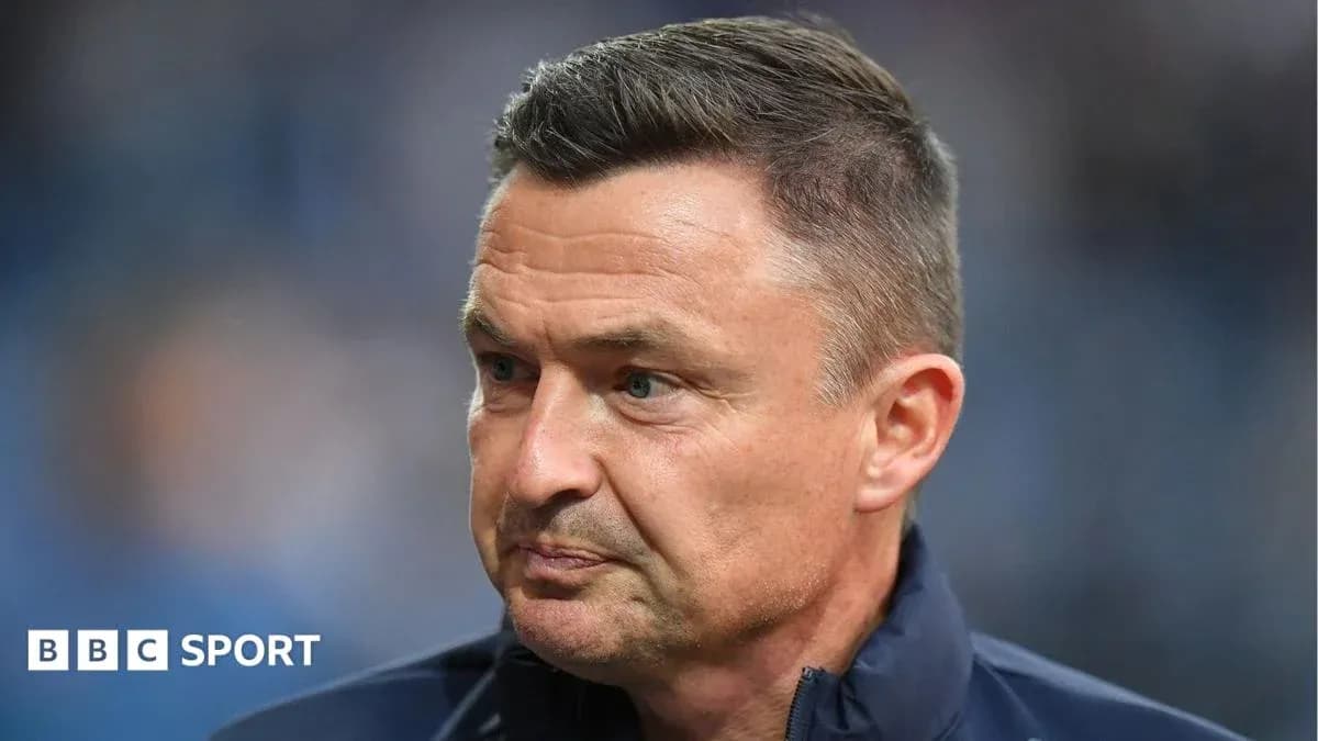 Coach with focused expression during match