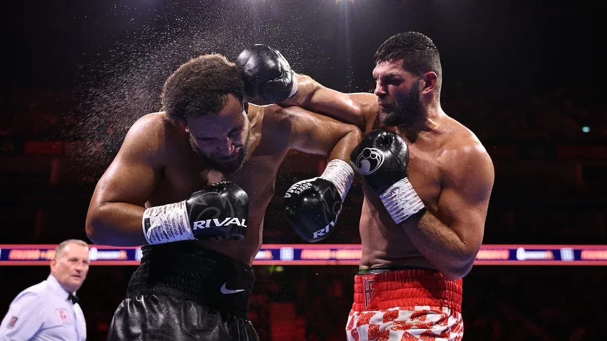 Two boxers exchanging punches in the ring