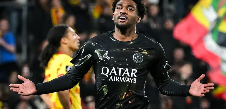 Player celebrating goal in black PSG jersey