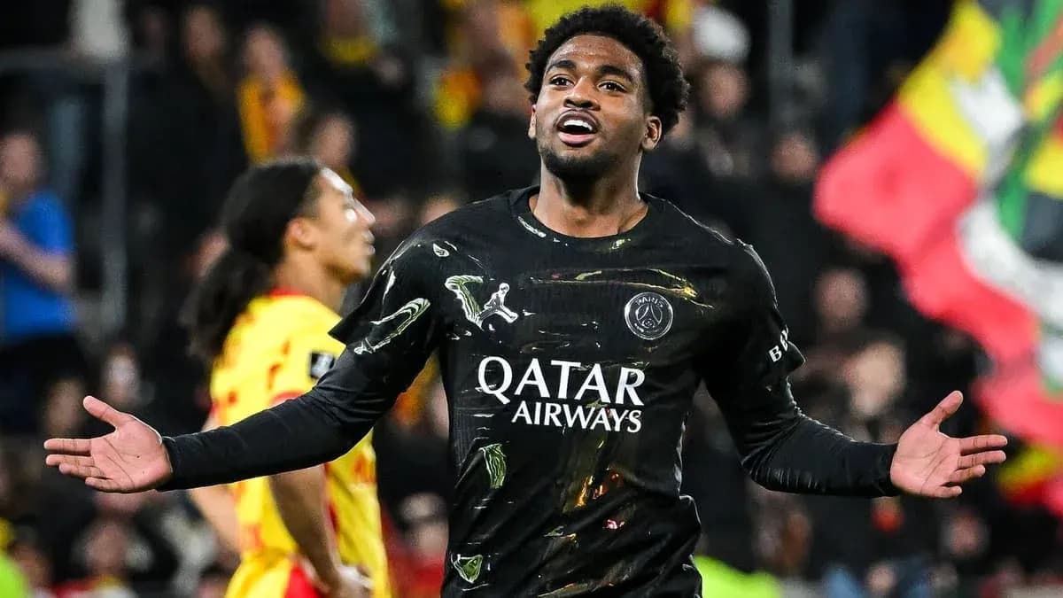 Player celebrating goal in black PSG jersey