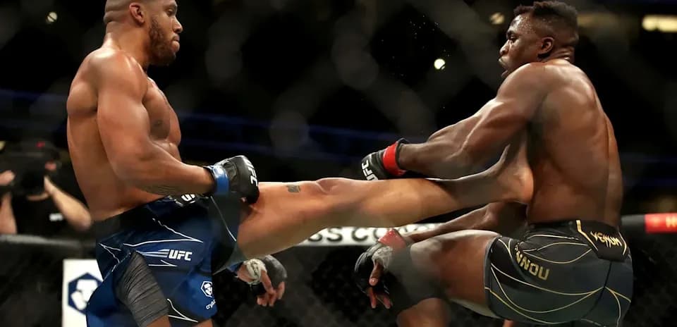 Two fighters exchanging kicks in UFC match