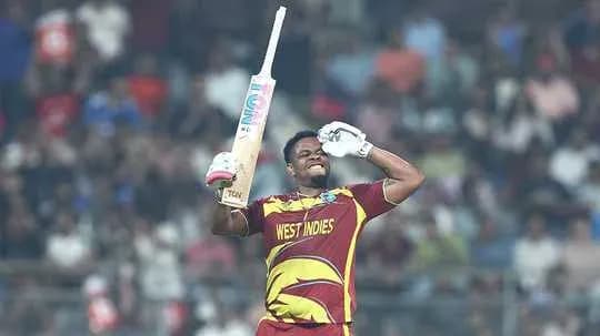 Cricketer celebrating with bat during match