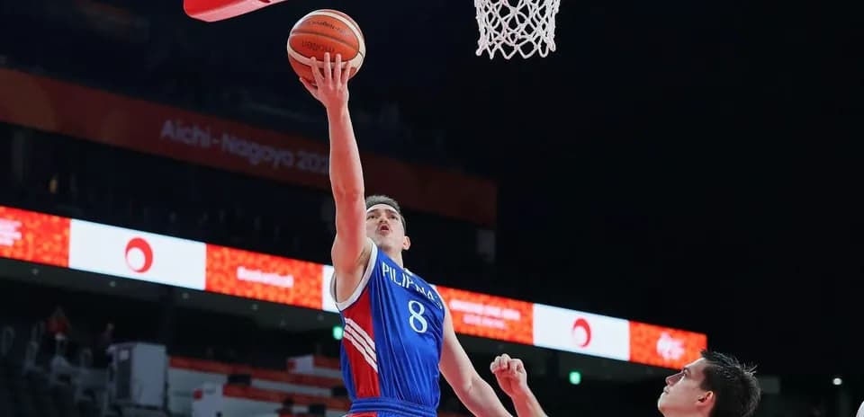 Player scoring a layup during a basketball game