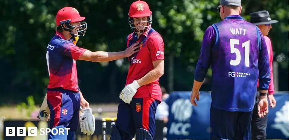 Players discussing during a cricket match on field