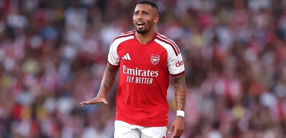 Player in Arsenal kit during match action