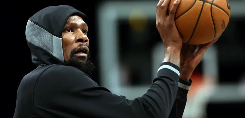 Player preparing to shoot basketball during practice