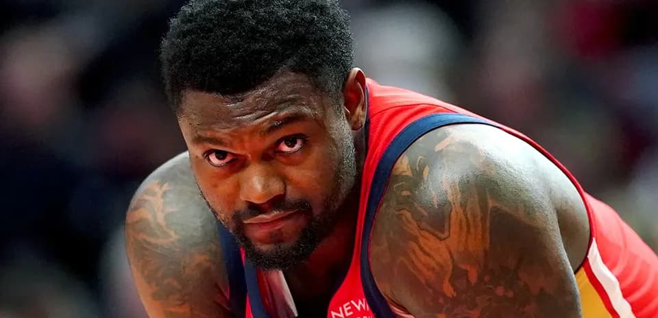 Basketball player focused during game action