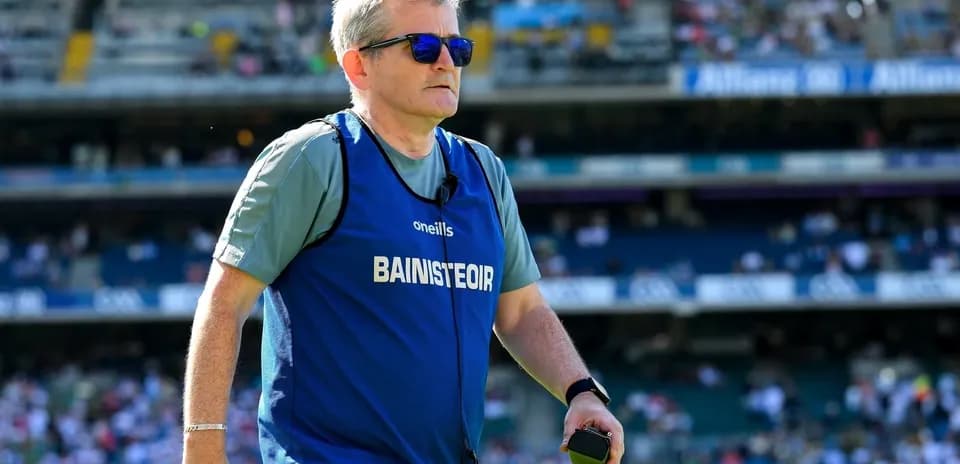 Coach wearing sunglasses on the sidelines