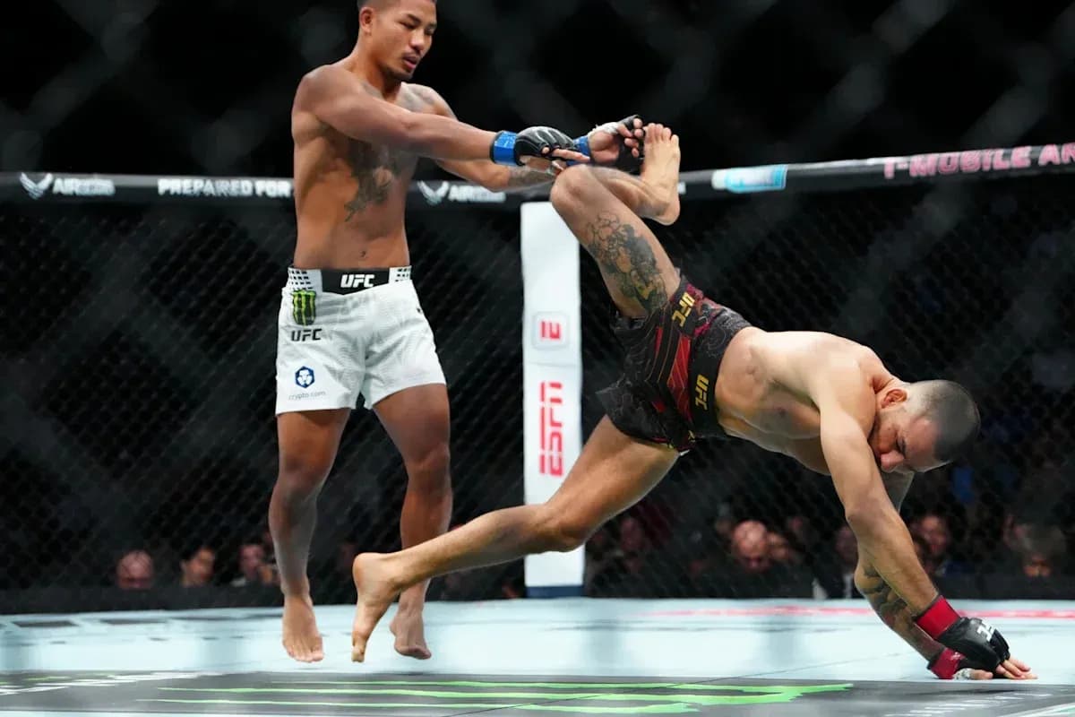 Fighter executing a takedown during MMA match