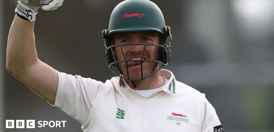 Cricketer celebrating after scoring runs on field
