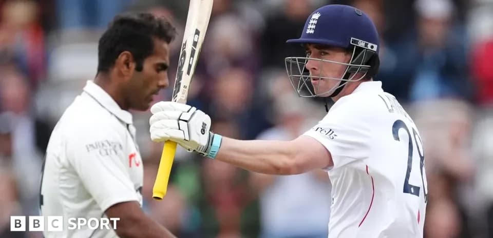 Batsman celebrating while facing bowler during cricket match