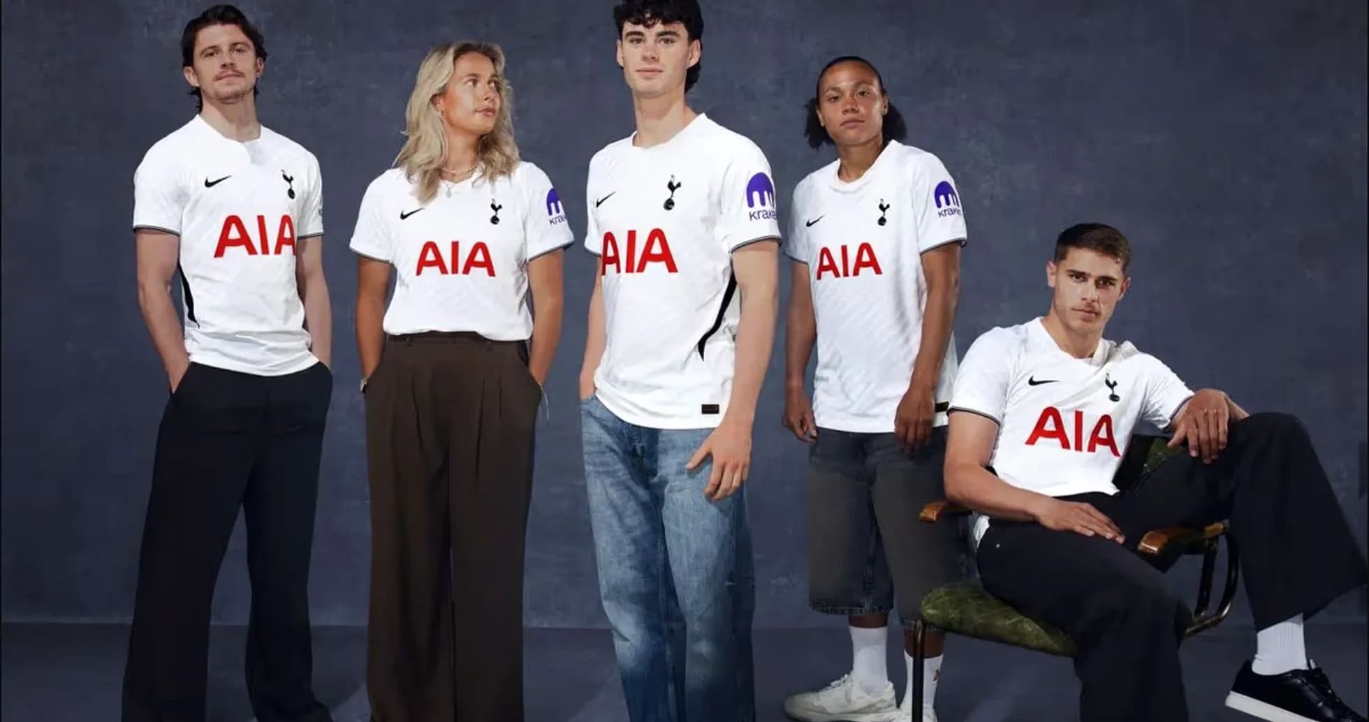 Five individuals wearing Tottenham Hotspur jerseys