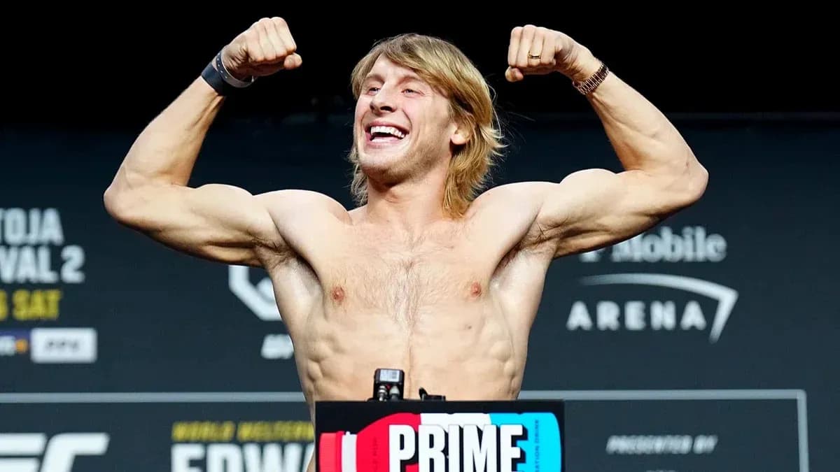 Fighter flexing muscles at weigh-in event