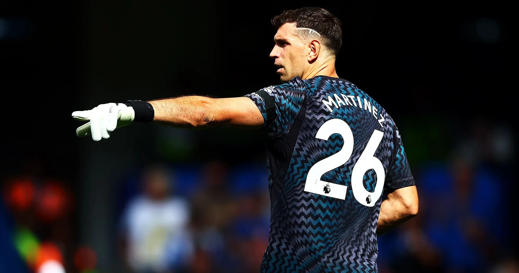 Goalkeeper pointing during match action on field
