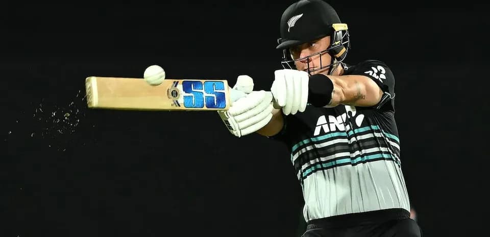 Batsman striking ball during cricket match