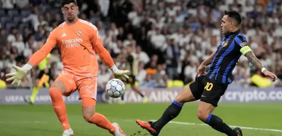 Goalkeeper attempting to save shot during match