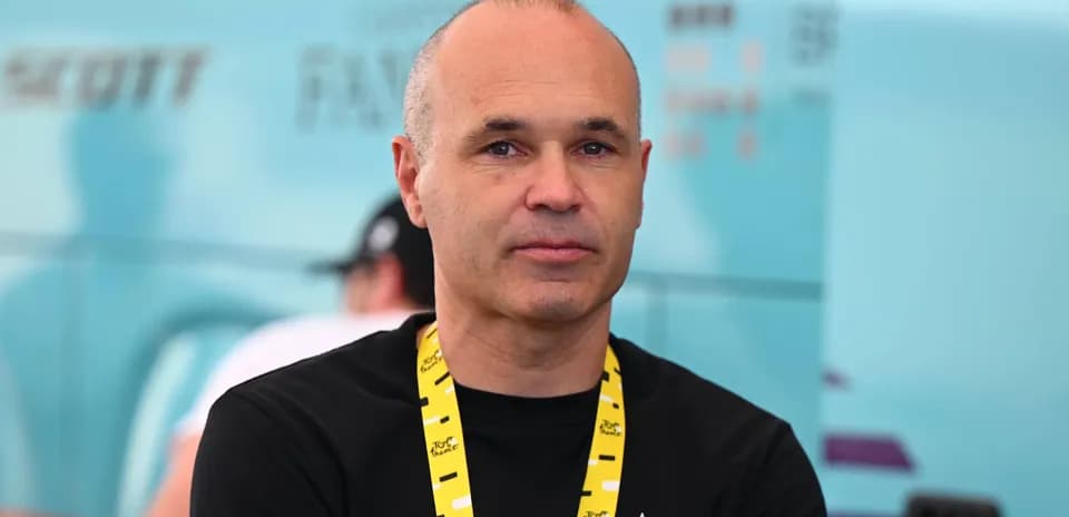 Man with lanyard posing in a team area