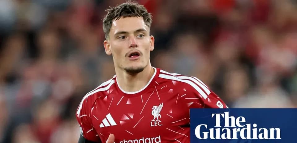 Player wearing Liverpool kit during match action