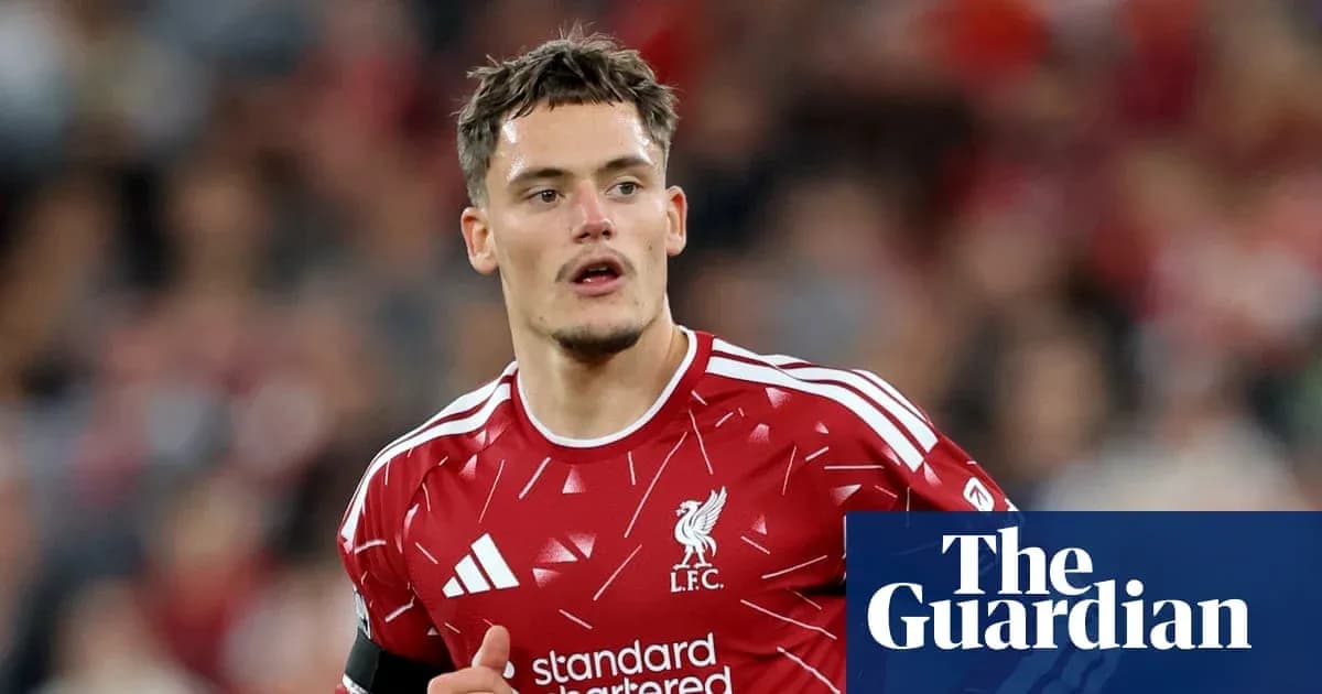 Player wearing Liverpool kit during match action