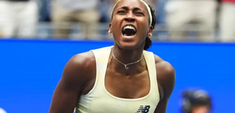 Tennis player celebrating a point during match
