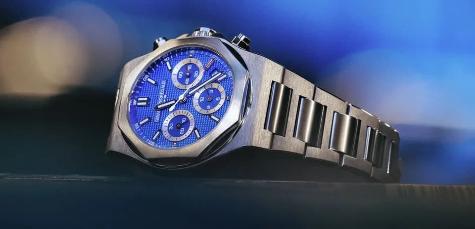 Luxury watch with blue dial and metal bracelet
