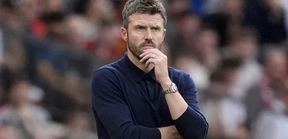 Coach observing the match with thoughtful expression