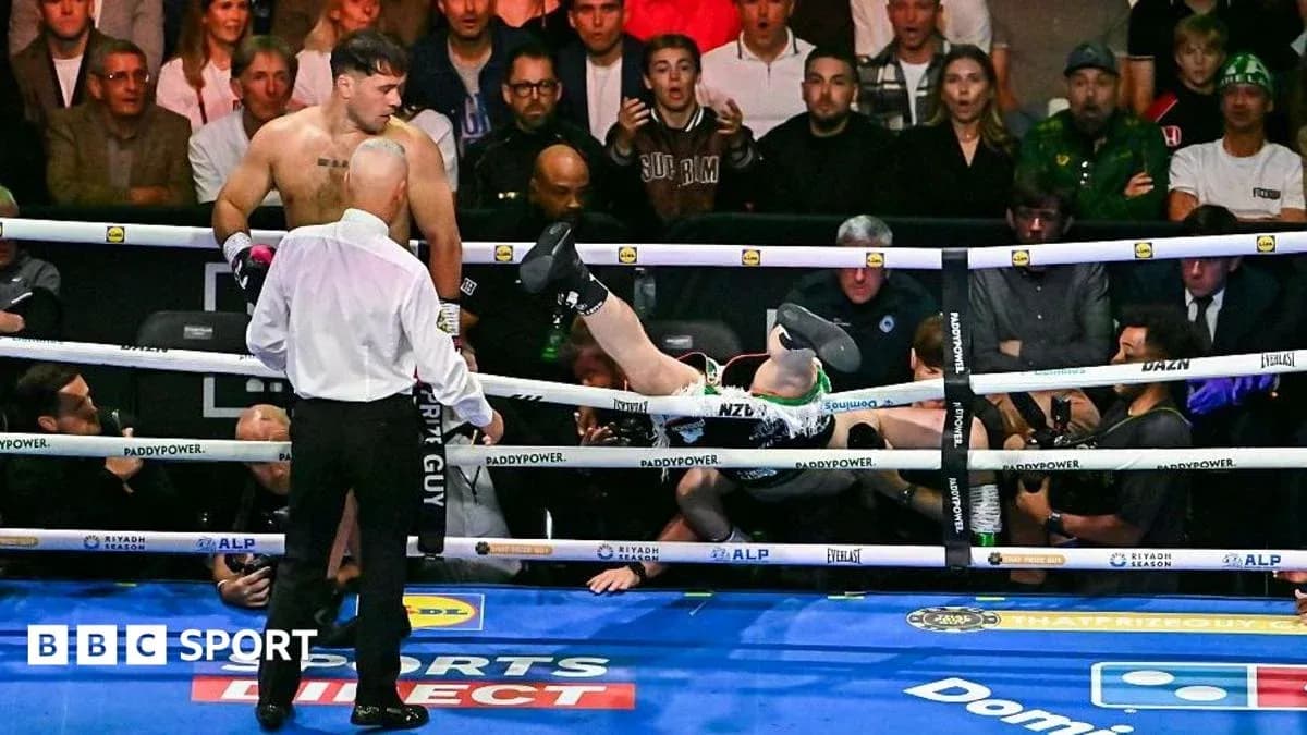 Boxer knocked out and falling outside the ring