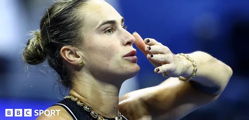 Tennis player blowing a kiss after match