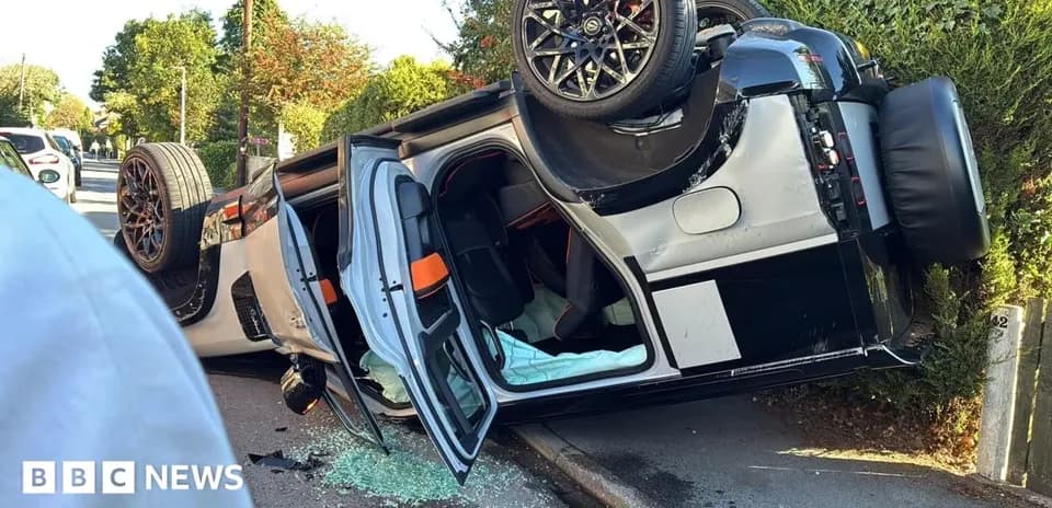 Upside-down car on the side of the road