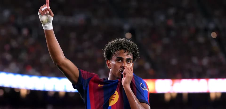 Player celebrating by raising finger and kissing jersey