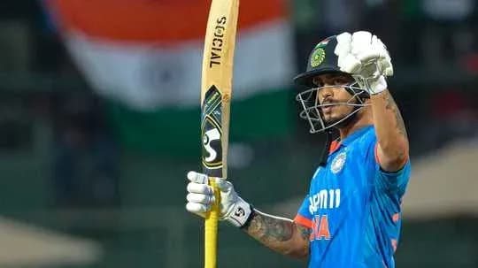 Batsman celebrating with bat after scoring runs Batsman celebrating with bat after scoring runs