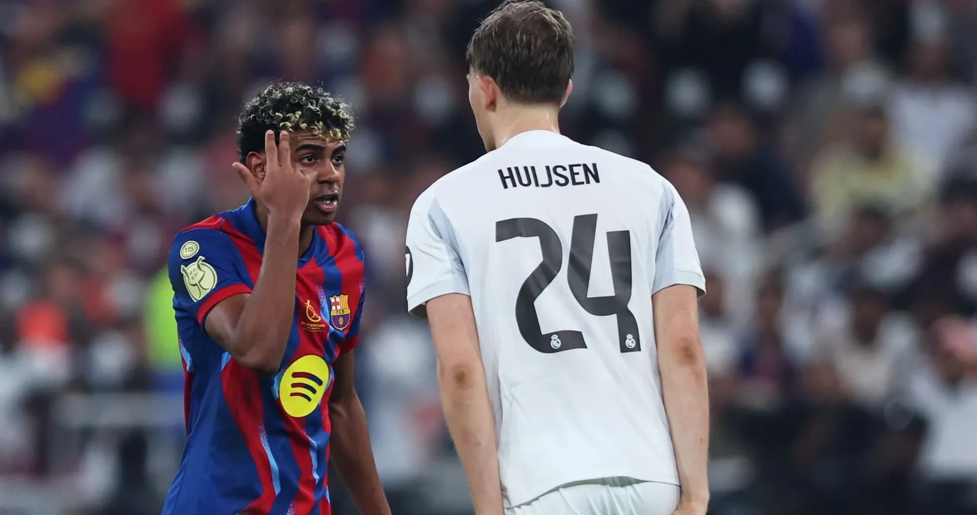 Barcelona player discussing with Real Madrid opponent Barcelona player discussing with Real Madrid opponent