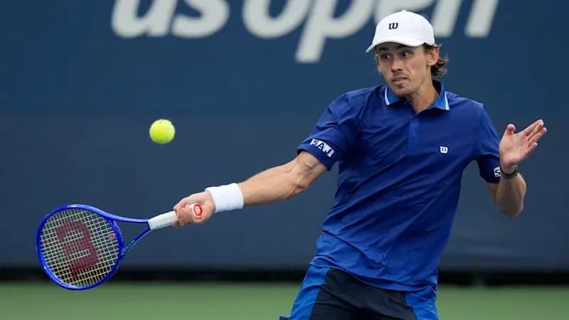 Player hitting a backhand shot during match Player hitting a backhand shot during match