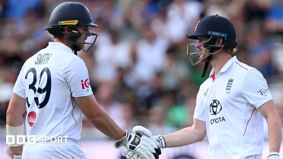 Two cricketers shaking hands during a match Two cricketers shaking hands during a match