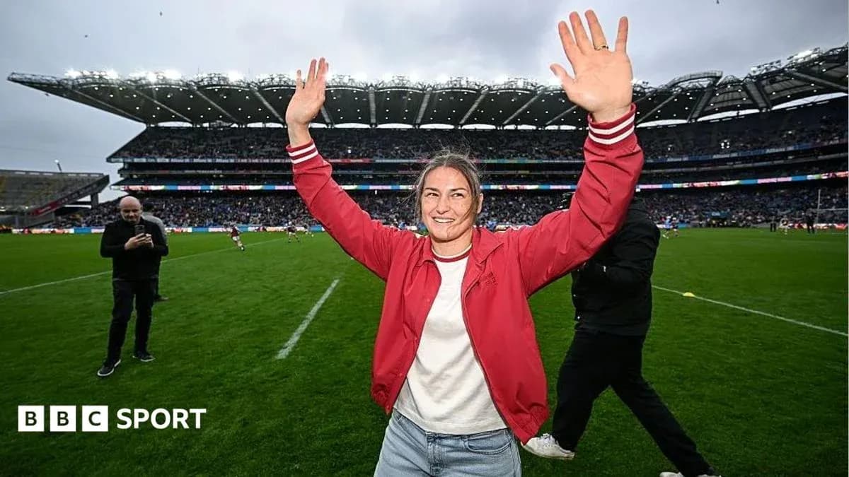 Person celebrating on the field at a stadium Person celebrating on the field at a stadium