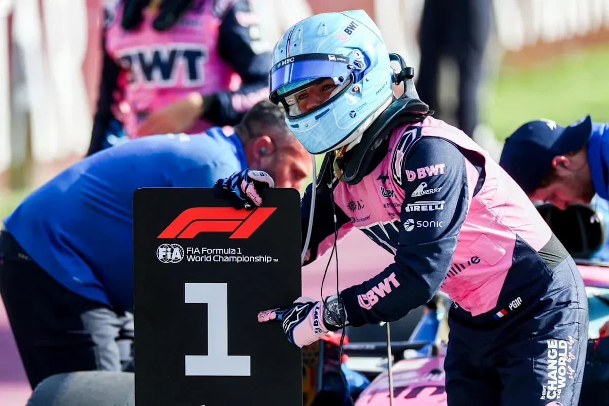 Driver holding number one sign during Formula 1 event Driver holding number one sign during Formula 1 event