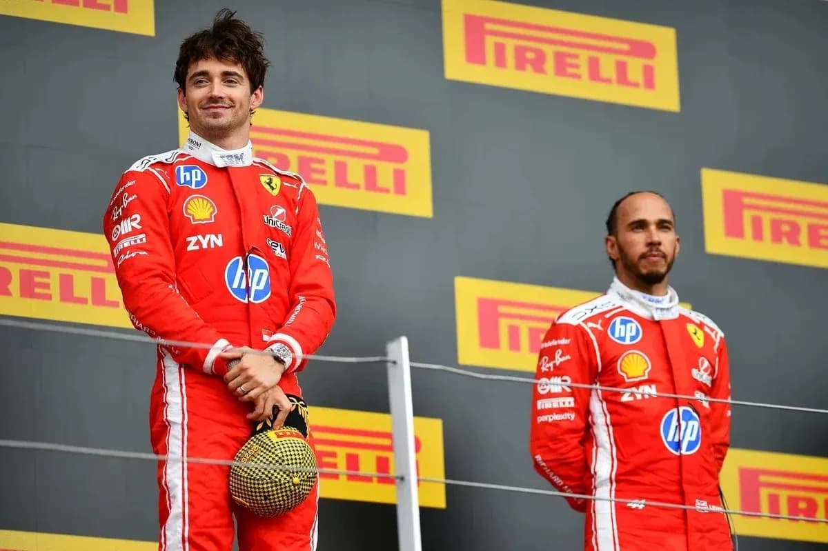 Two drivers on podium after a race Two drivers on podium after a race