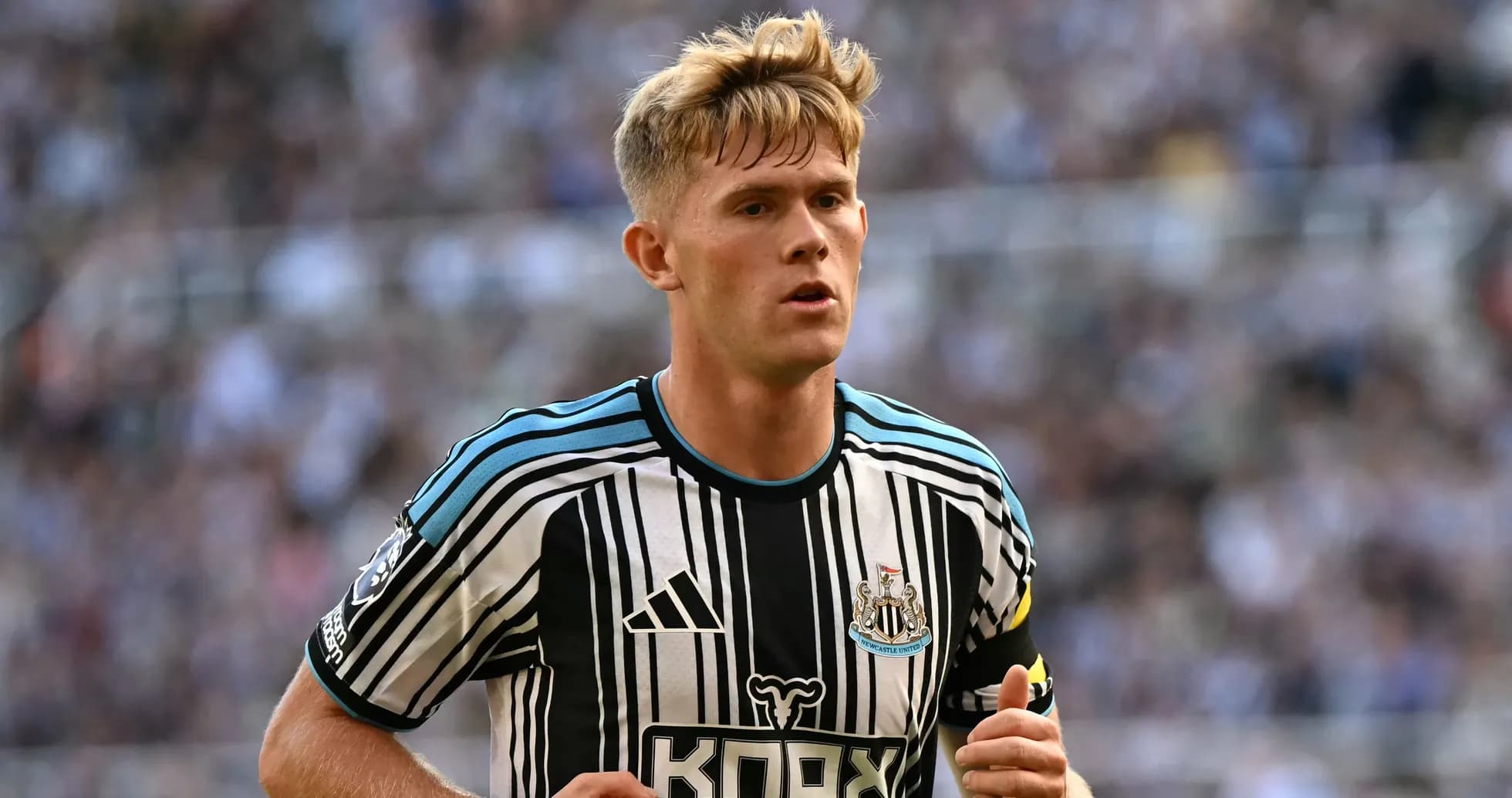 Newcastle United player running during a match Newcastle United player running during a match