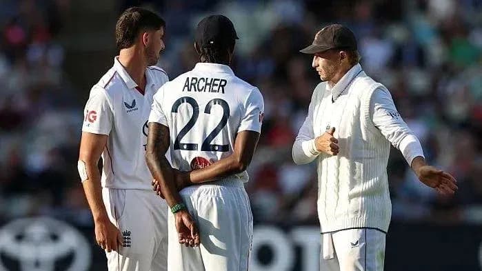 Players discussing strategy with umpire on field Players discussing strategy with umpire on field