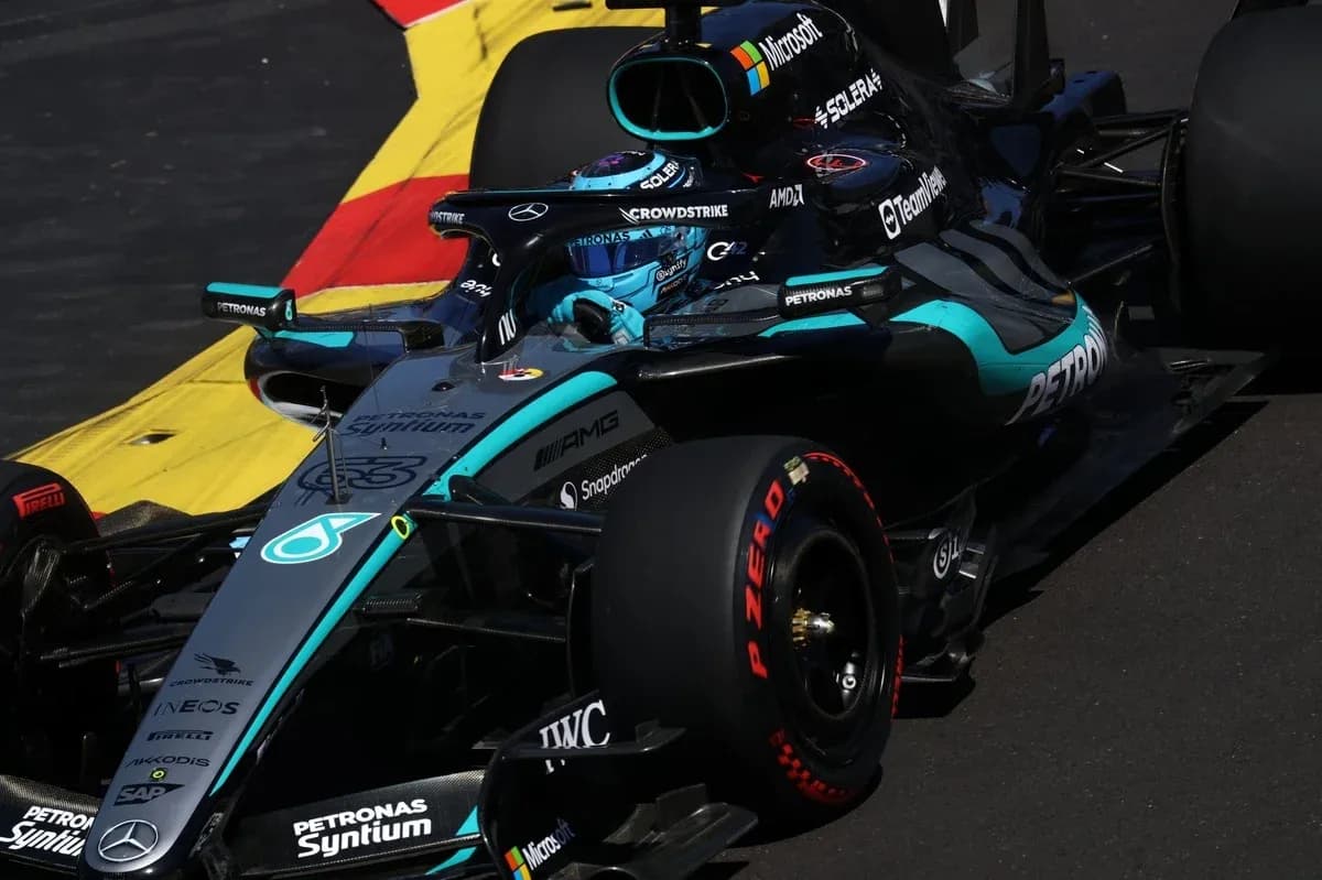 Mercedes F1 car racing on track during event Mercedes F1 car racing on track during event