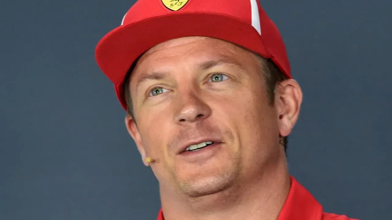 Driver wearing a red cap during press conference Driver wearing a red cap during press conference