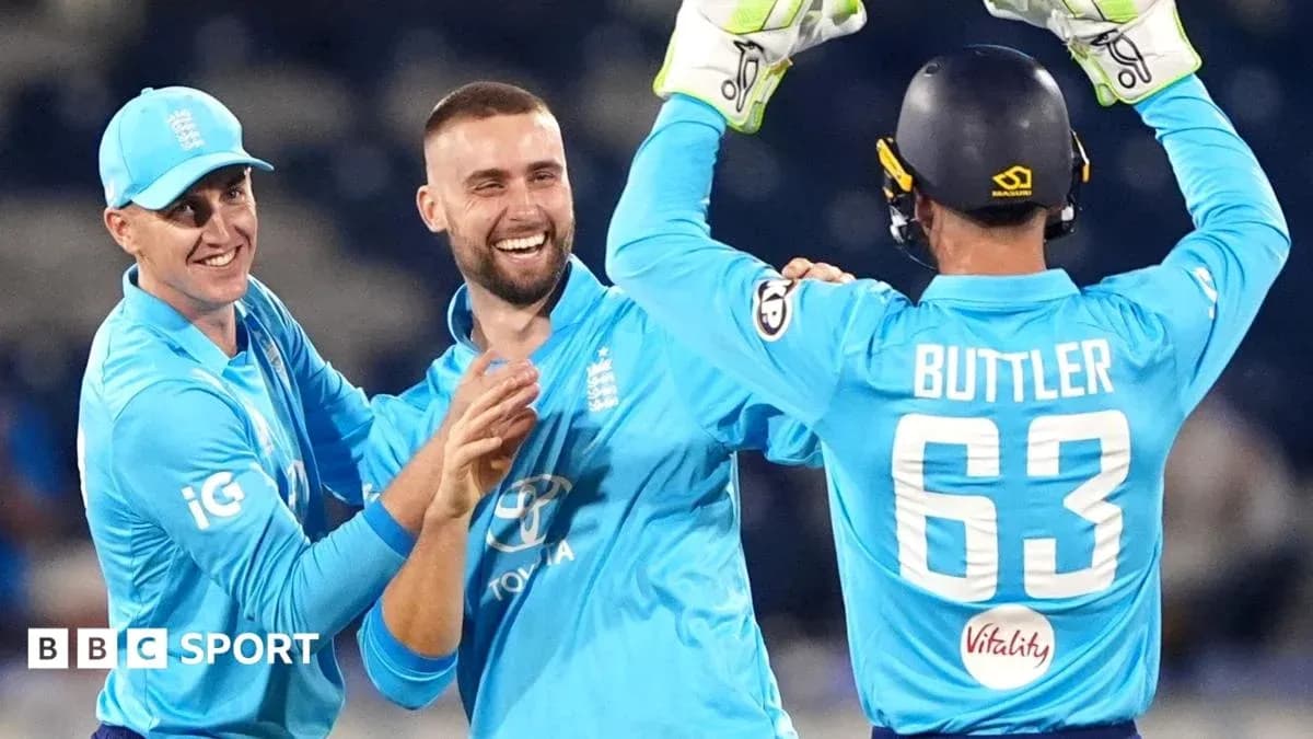 England players celebrating during a cricket match England players celebrating during a cricket match