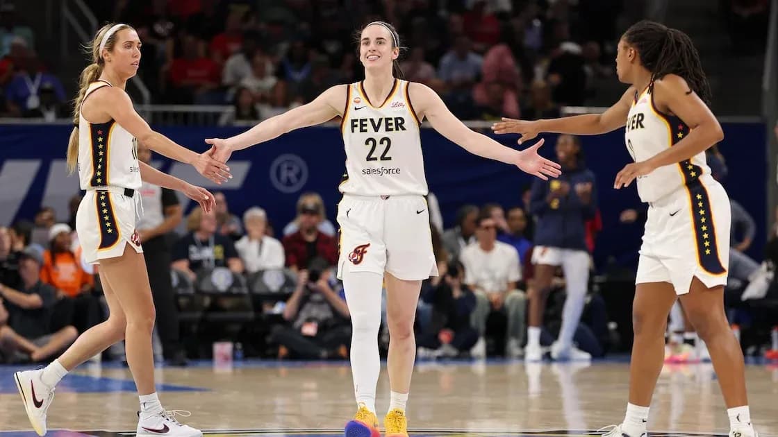 Three players celebrating on the basketball court Three players celebrating on the basketball court