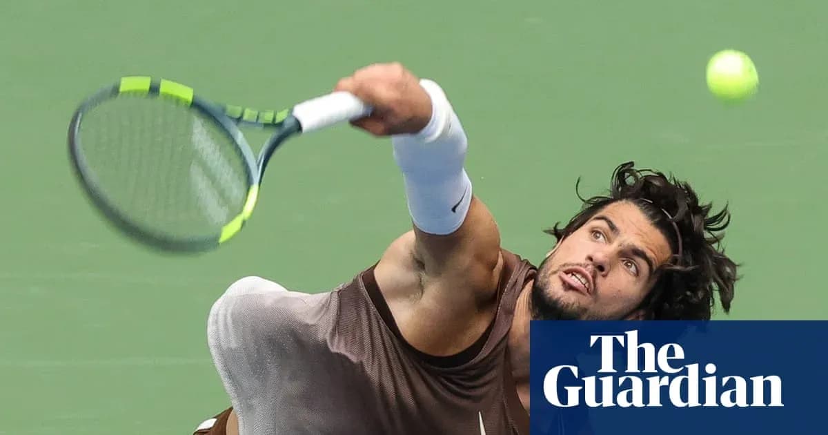 Player serving the ball during a tennis match Player serving the ball during a tennis match