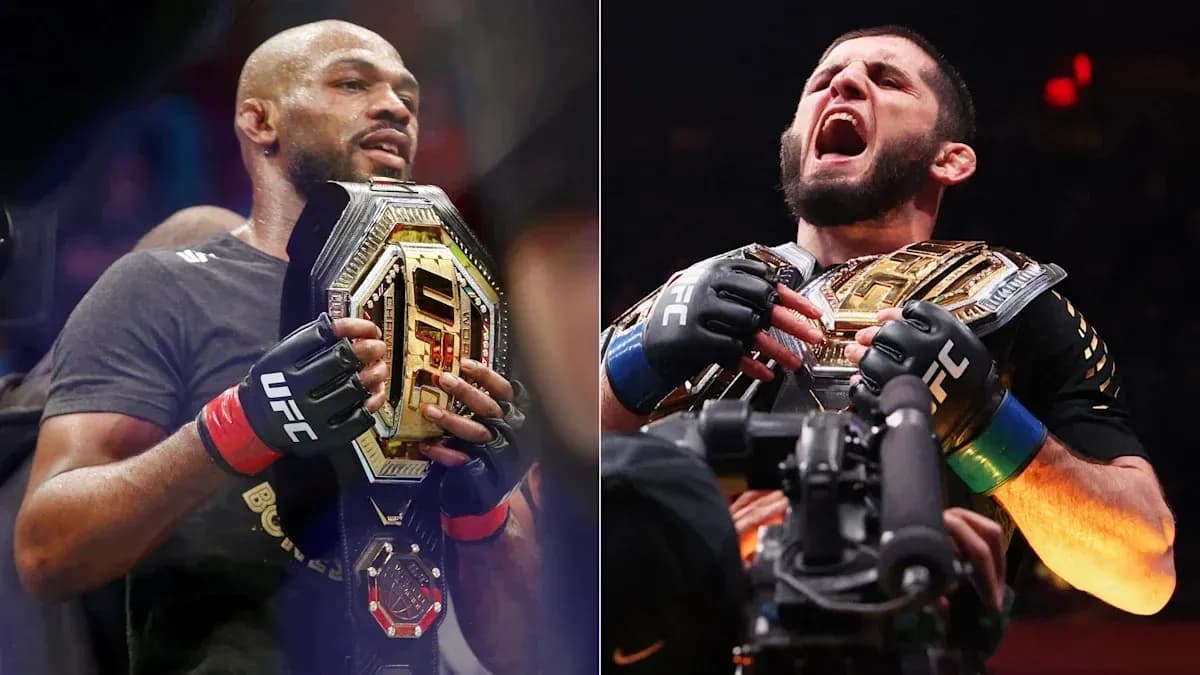 Two UFC champions holding their championship belts Two UFC champions holding their championship belts